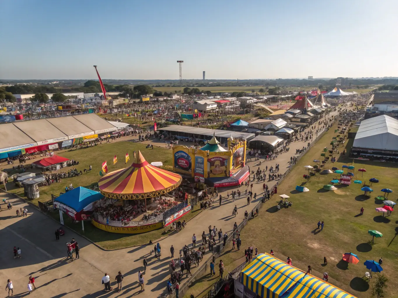 A vibrant scene of a community event where people of all ages and backgrounds are enjoying hot air balloon demonstrations and tethered rides. The atmosphere is festive and inclusive, showcasing MONTGOLFIERE EVASION's commitment to community engagement.